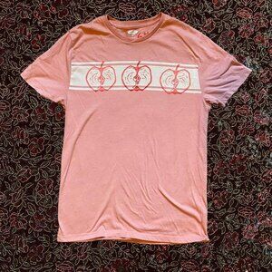 Apple linocut print in red and pink on pink tee